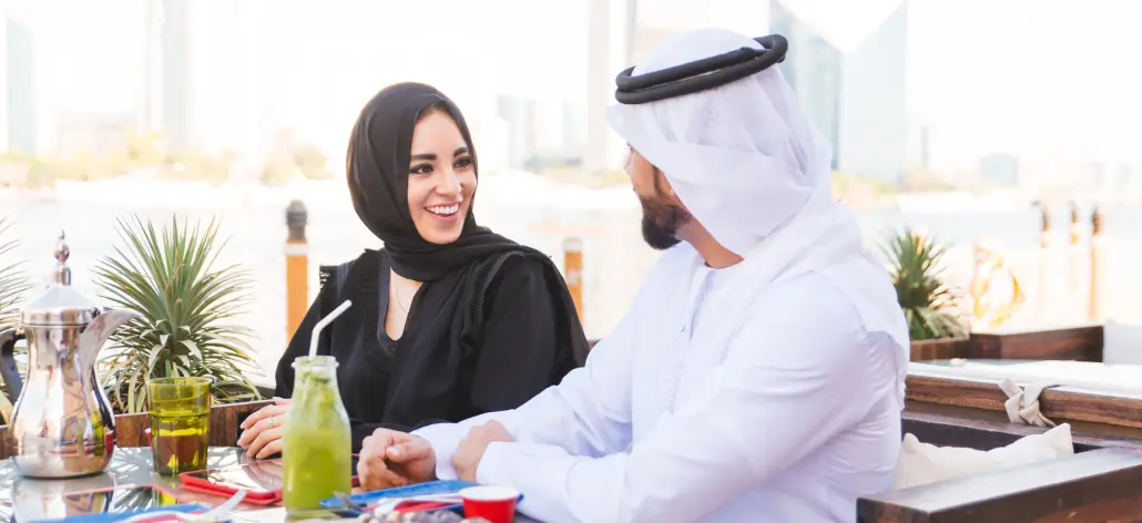 Saudi couple at outdoor restaurant dining