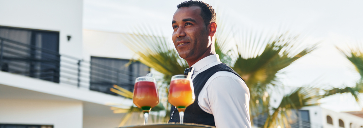 Waiter serving food ordered using TableQR Digital Menu