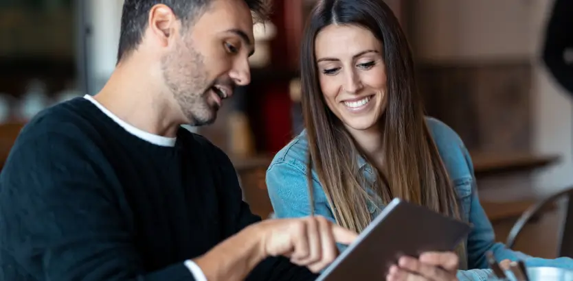 Couple using TableQR menu multi language feature to order food at the restuarant.