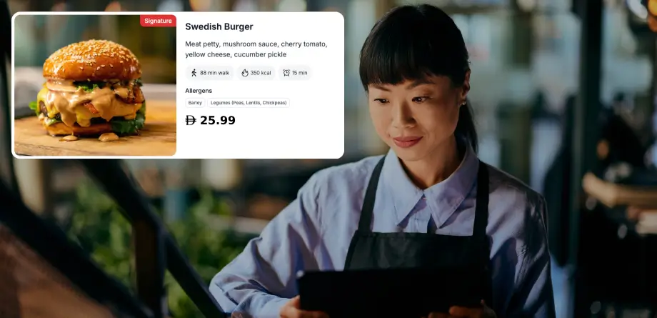 Restaurant manager reviewing a compliant TableQR digital menu with allergens and pricing for UAE rules