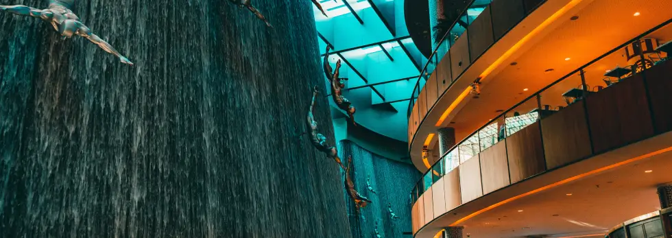 TableQR digital menu for Dubai restaurants shown over Dubai Mall waterfall interior