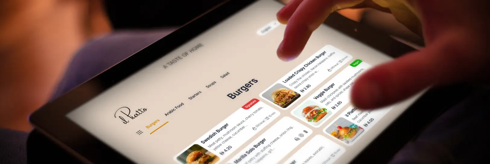 Guest using digital menu on ipad to order food on table.