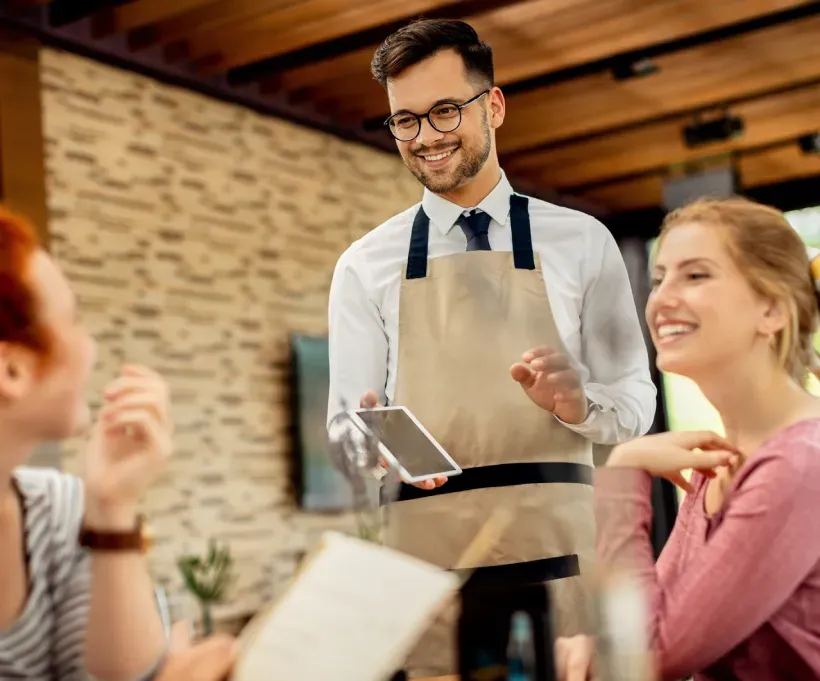 Floor manager asking guests for their experience and feedback.